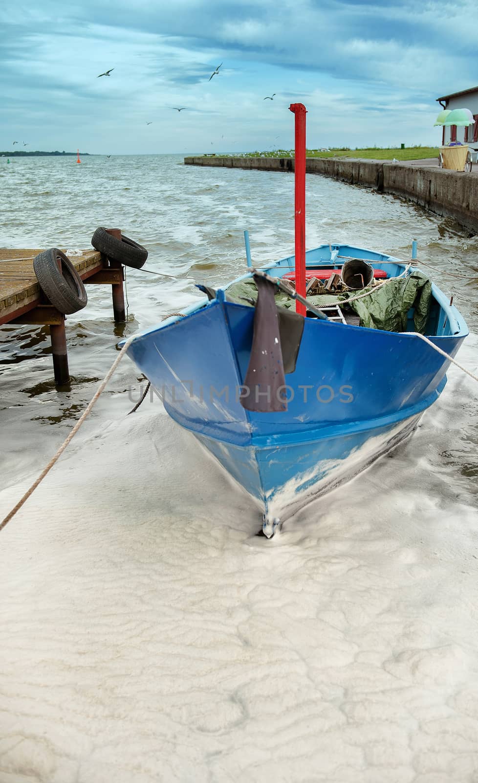 An image of boat moored in the harbor