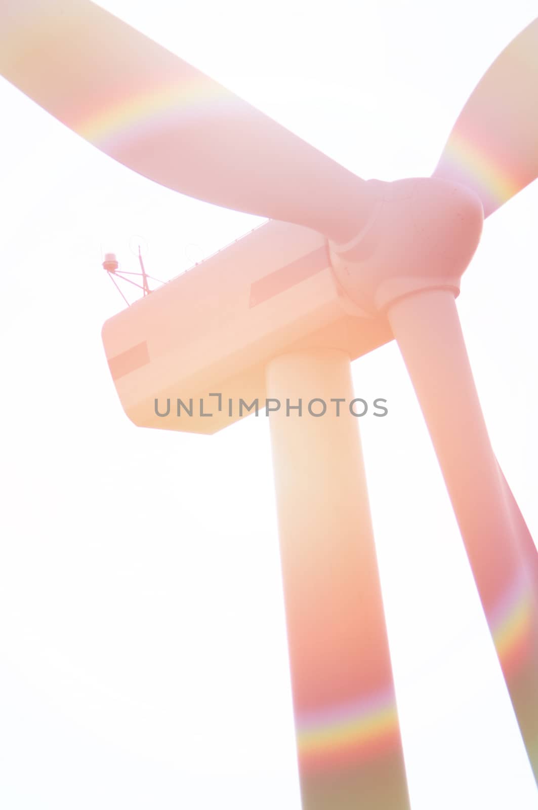 Wind turbine against deep blue sky -