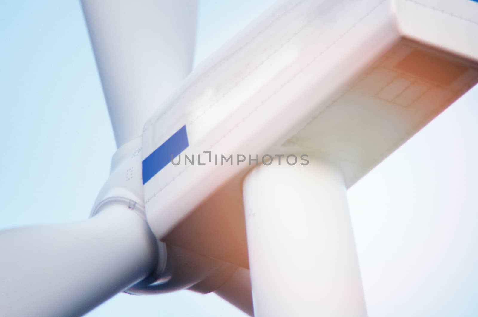 Wind turbine against deep blue sky -