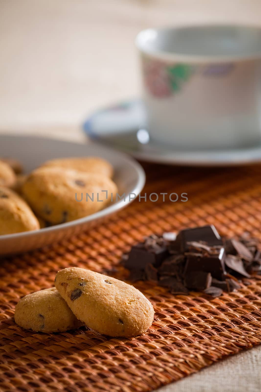 Cookies with chocolate chips on a tablecloth by LuigiMorbidelli