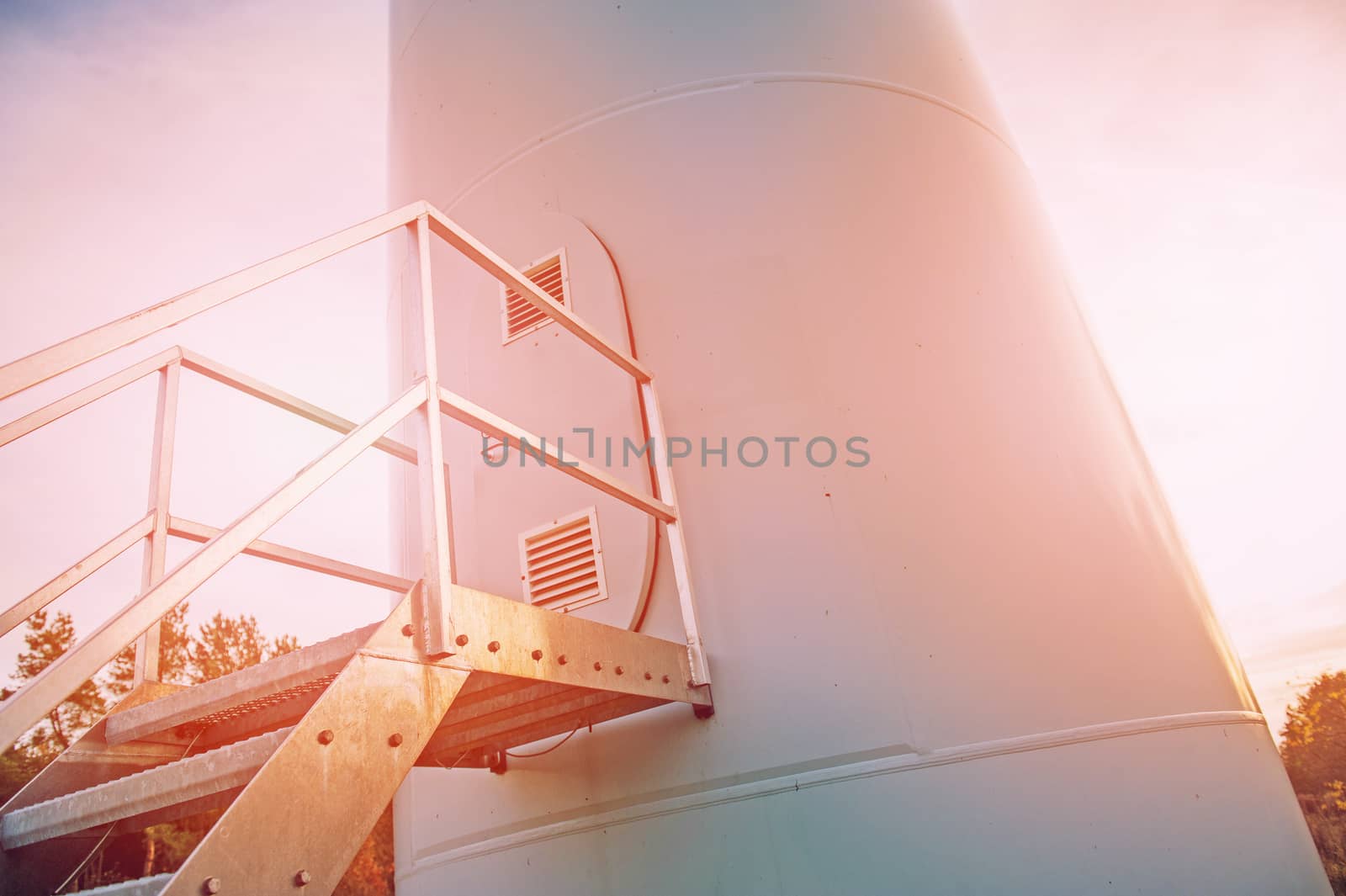 Wind turbine against deep blue sky -