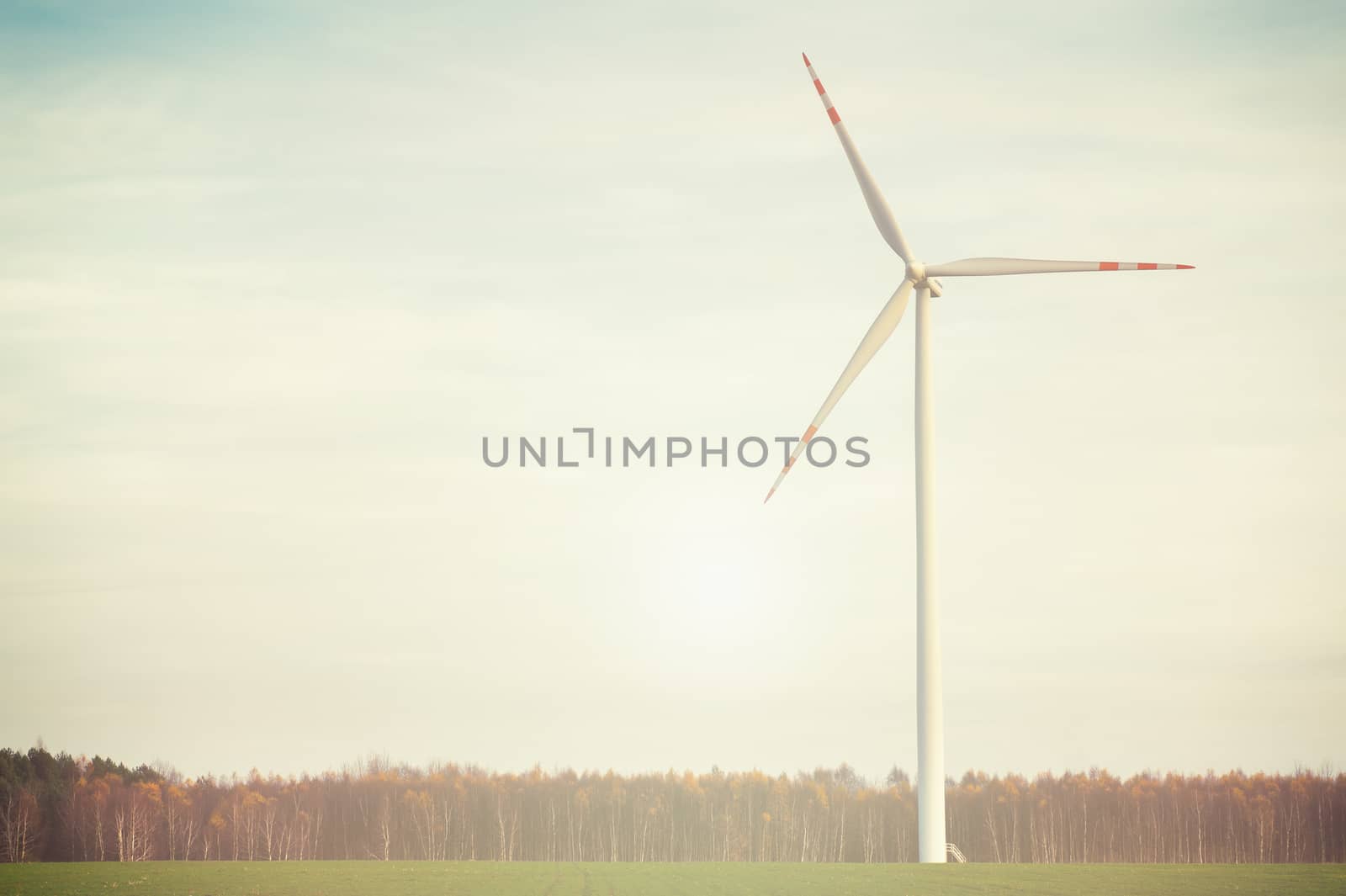 Wind turbine against deep blue sky -