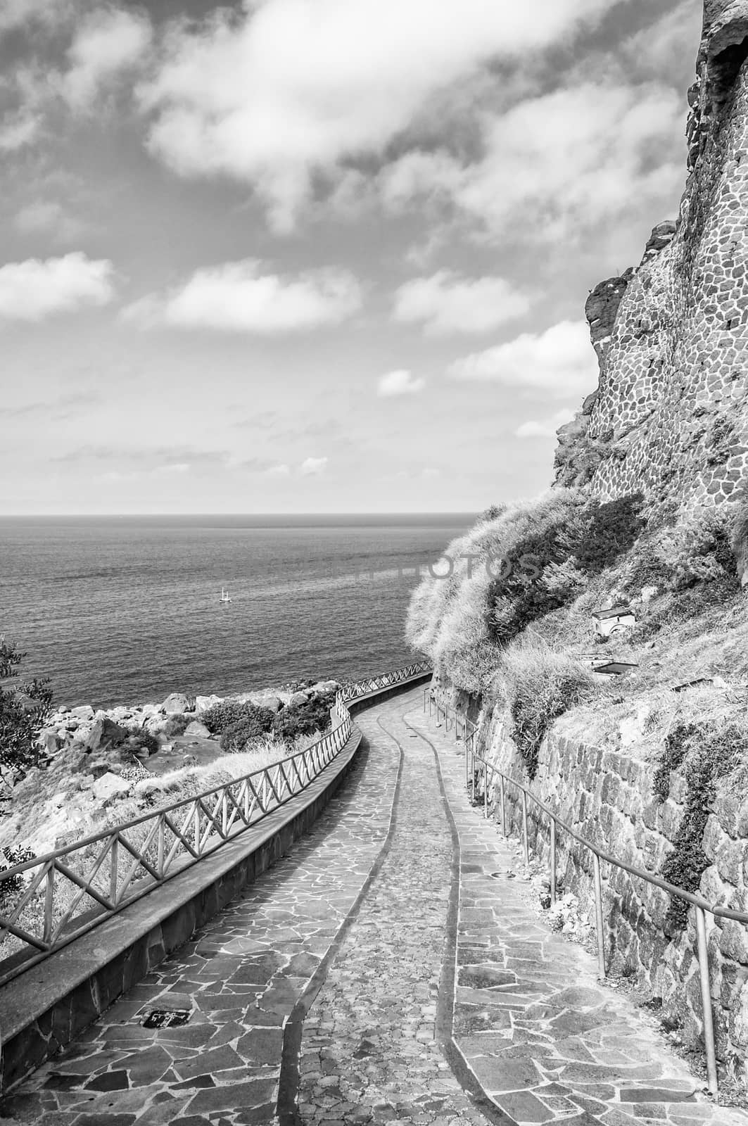 the beautiful alley of castelsardo old city in black and white by replica
