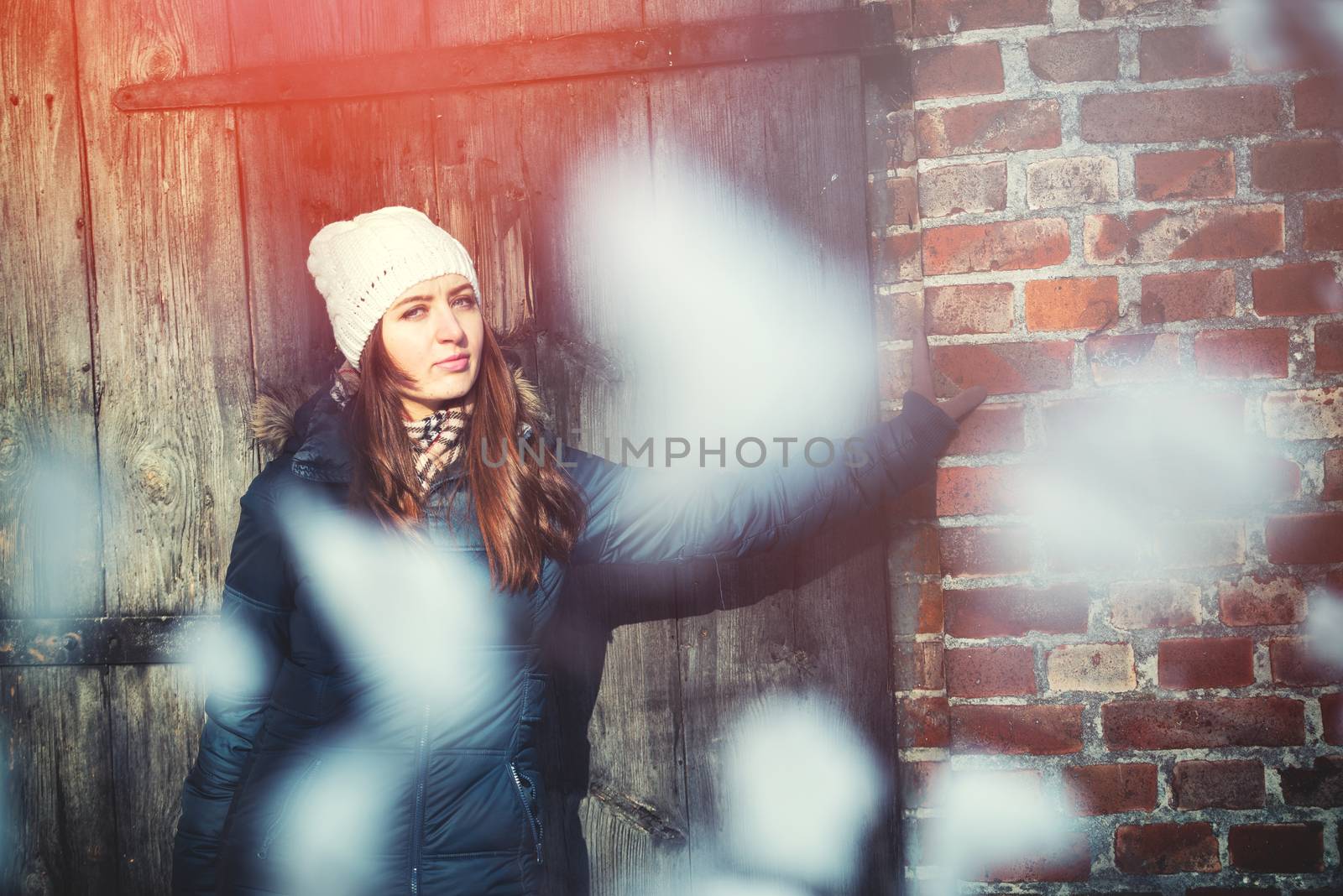 An image of young woman on a walk in snowy winter