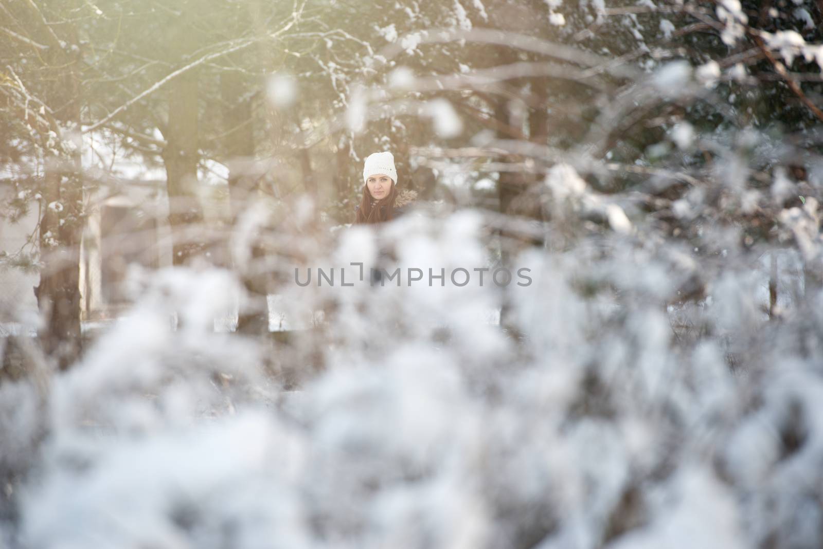 Young woman on a walk in snowy winter by Brejeq