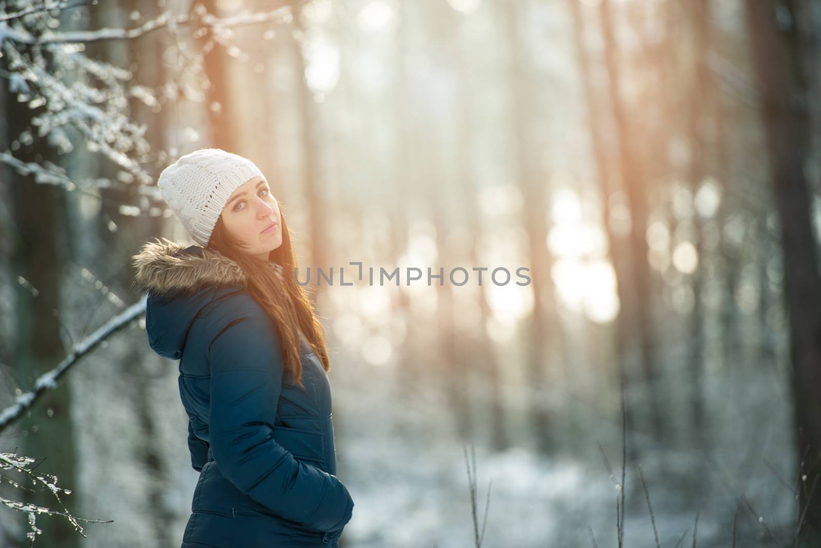 Young woman on a walk in snowy winter by Brejeq