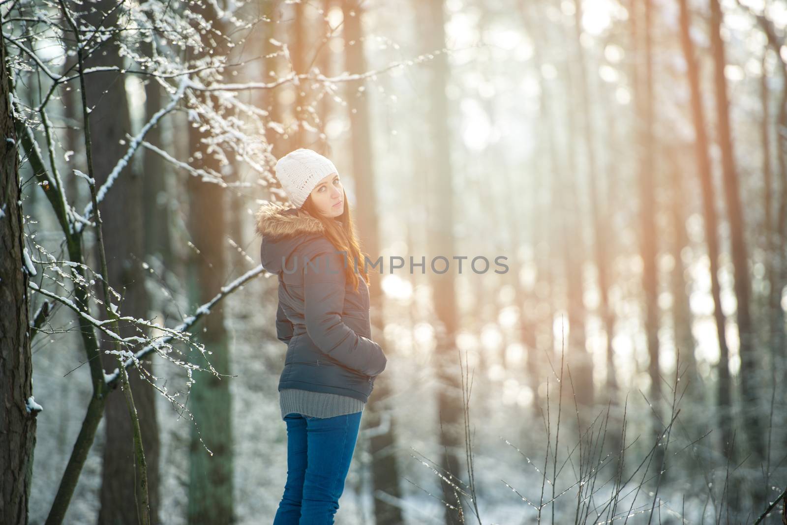 Young woman on a walk in snowy winter by Brejeq