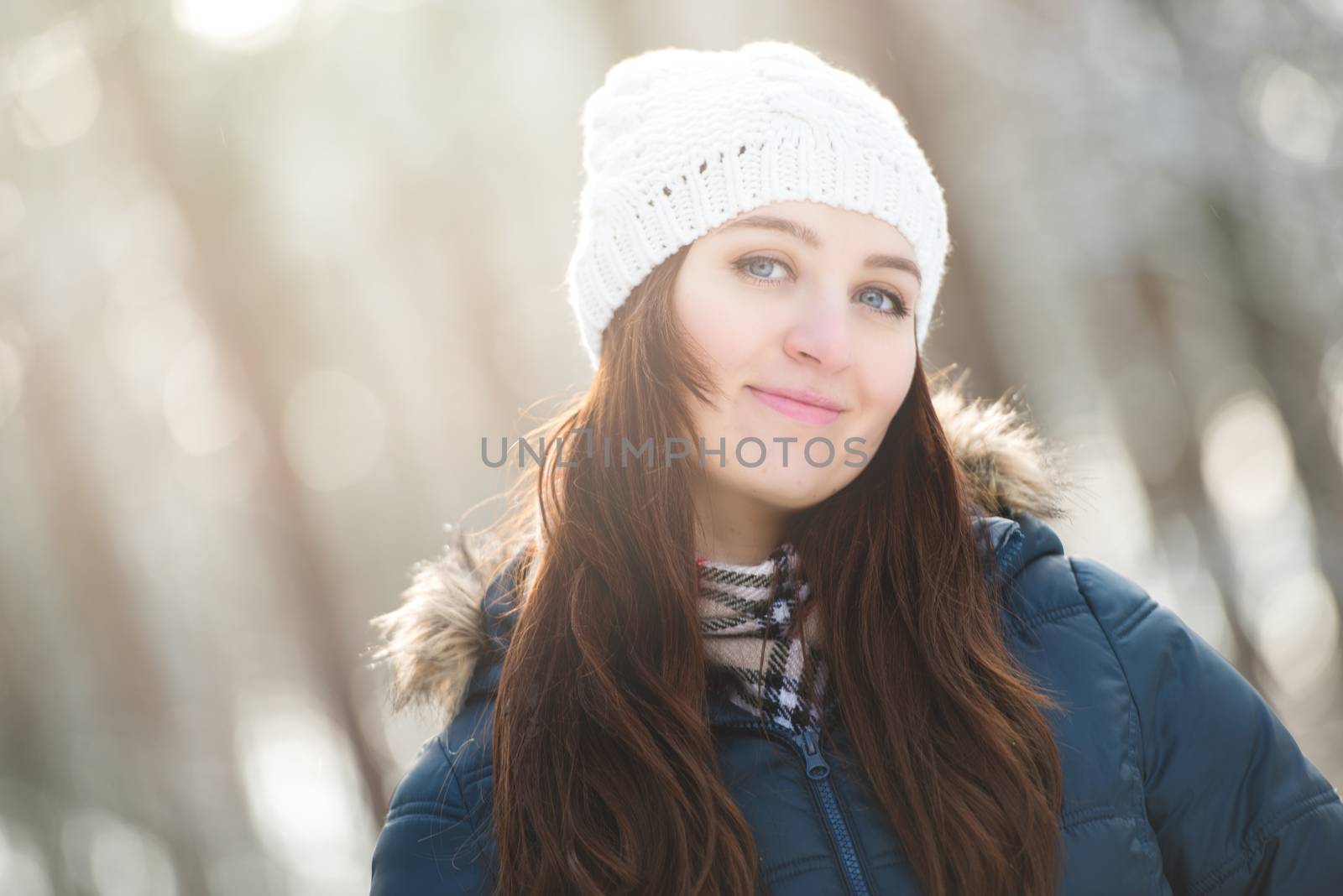 Young woman on a walk in snowy winter by Brejeq