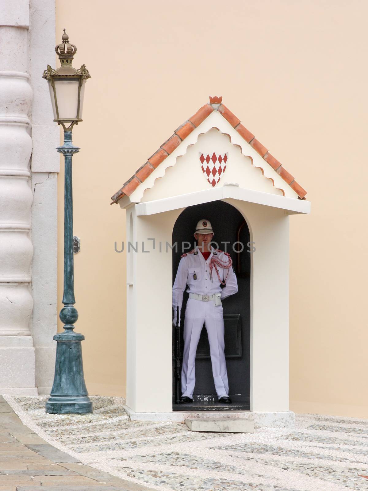 Monaco, France - July 05 2012. Officer in dress uniform guarding the entrance to the Palace.