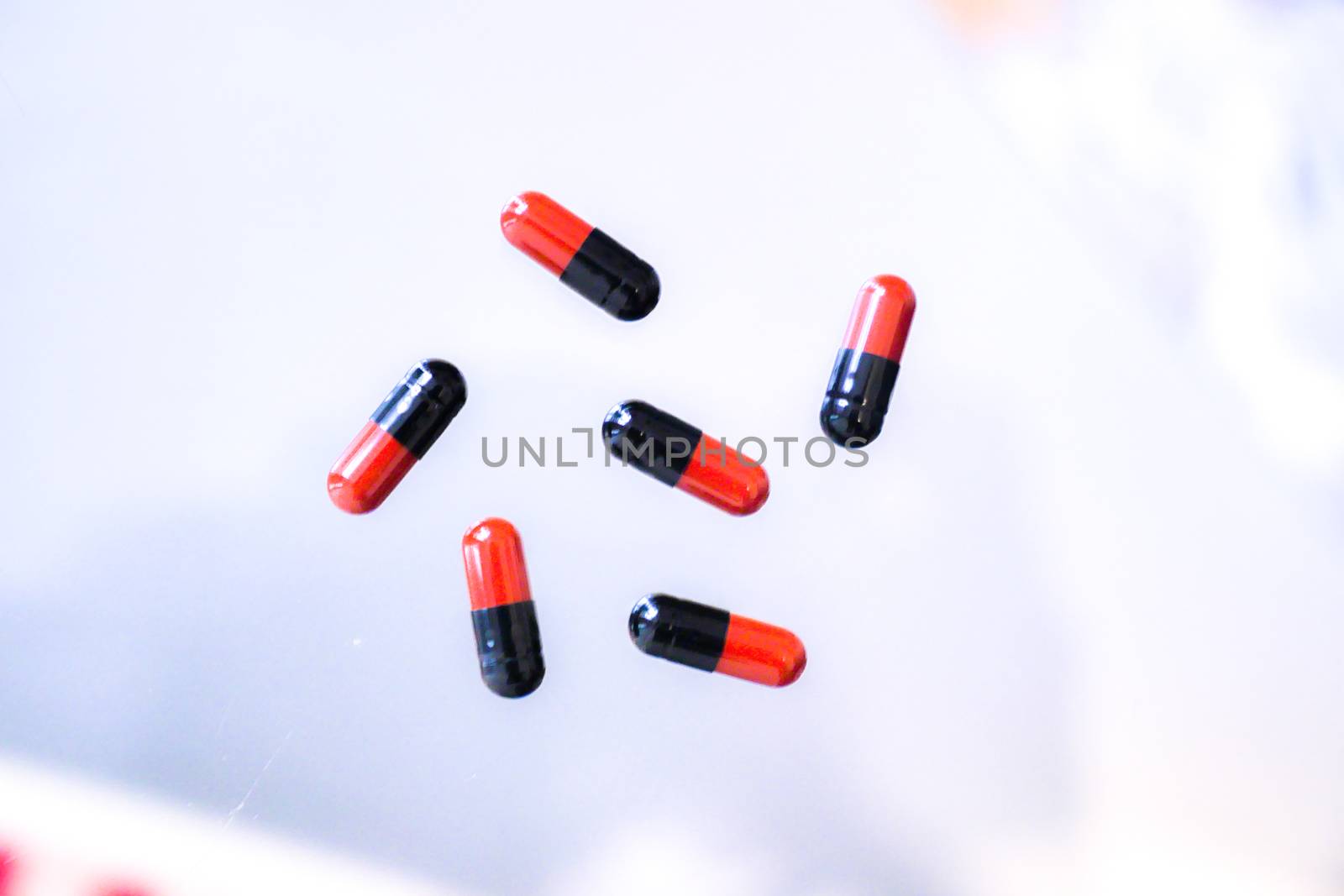 Medicine pills or capsules in hand, palm or fingers. Drug prescription for treatment medication..Antibiotic, painkiller closeup.