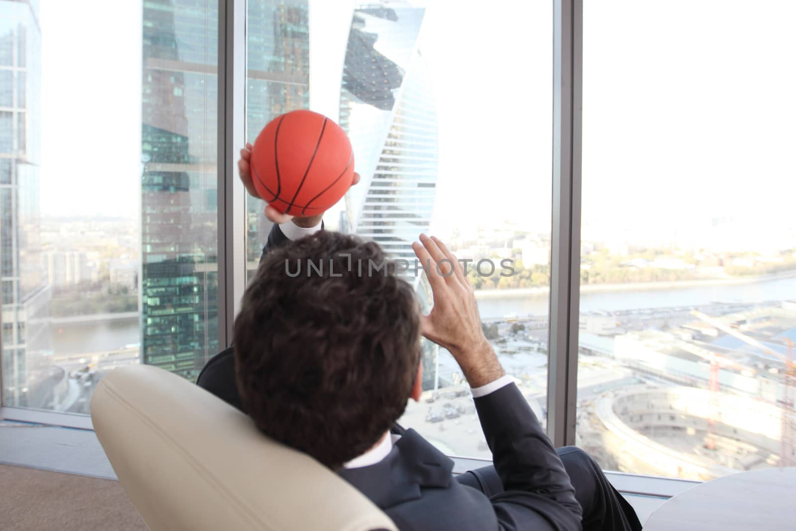 Businessman with basketball by ALotOfPeople