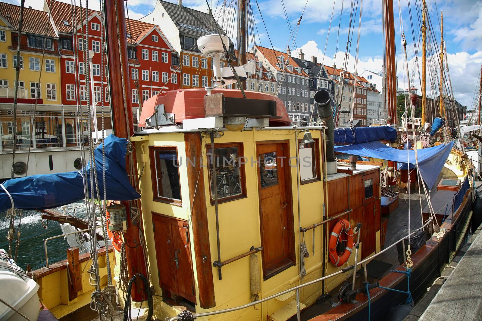 Yacht and color houses in seafront Nyhavn (new Harbor) in Copenhagen, Denmark