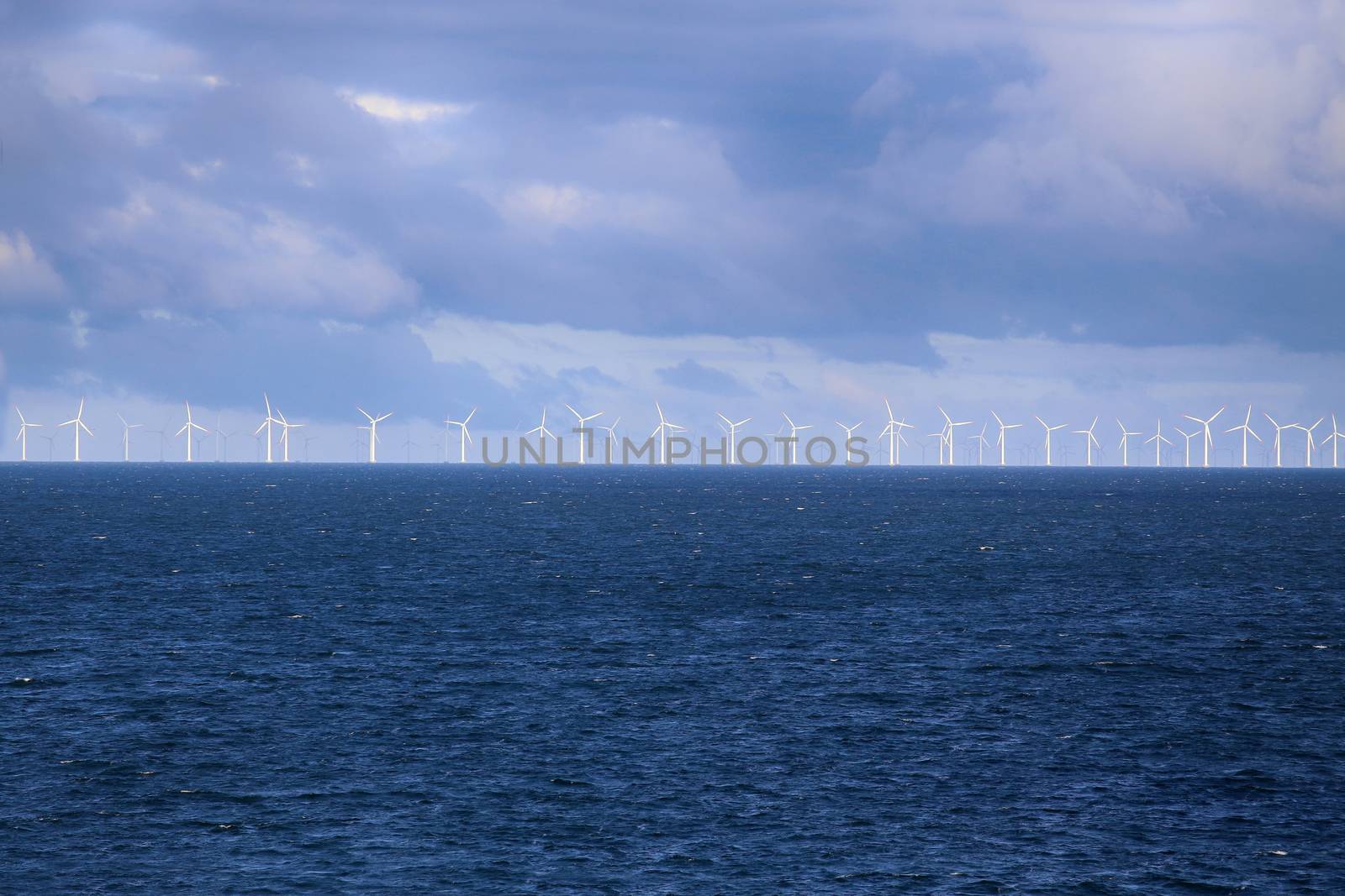 Windmills in a row in the Baltic sea