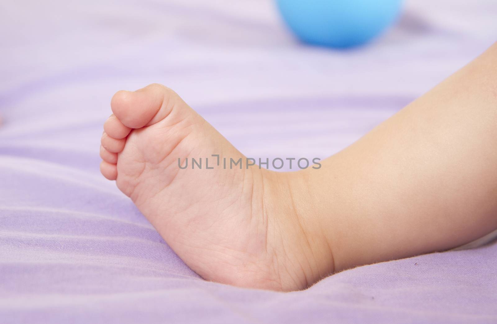 Infant foot;infantile foot;newborn closeup.