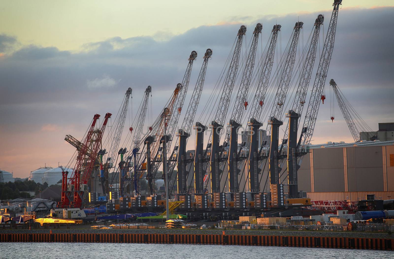 ROSTOCK, GERMANY - AUGUST 14, 2016: Container terminal and cranes in the port of Warnemunde. Rostock is largest Baltic port(photographed early in the morning)in Rostock, Germany on August 14, 2016.