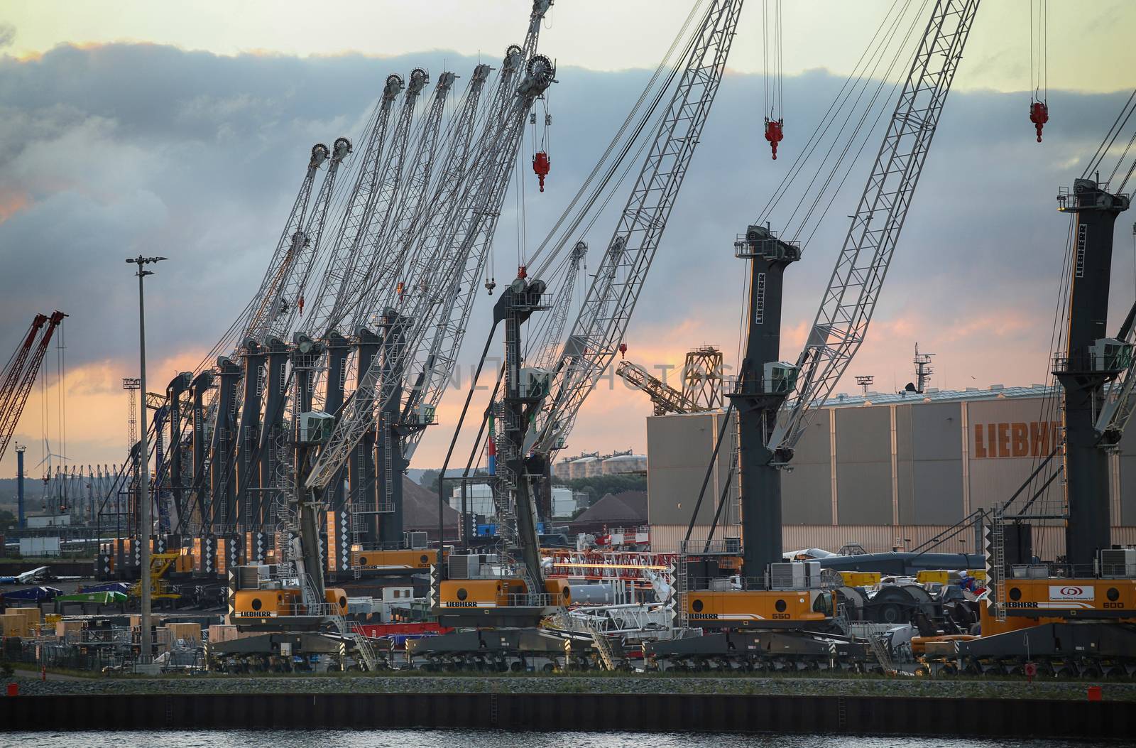 ROSTOCK, GERMANY - AUGUST 14, 2016: Container terminal and cranes in the port of Warnemunde. Rostock is largest Baltic port(photographed early in the morning)in Rostock, Germany on August 14, 2016.