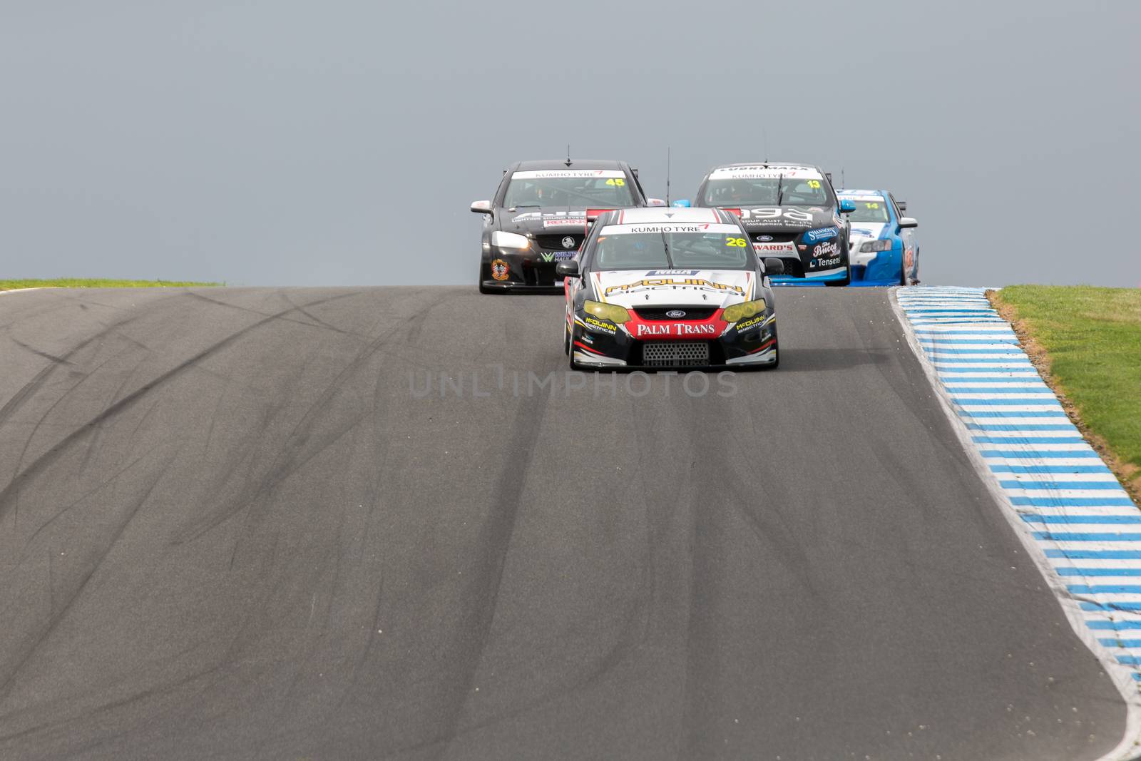 MELBOURNE/AUSTRALIA - SEPTEMBER 10, 2016: Kumho Tyre V8 Touring Cars coming into turn 10 for race 1 at Round 6 of the Shannon's Nationals at Phillip Island GP Track in Victoria, Australia 9-11 September.