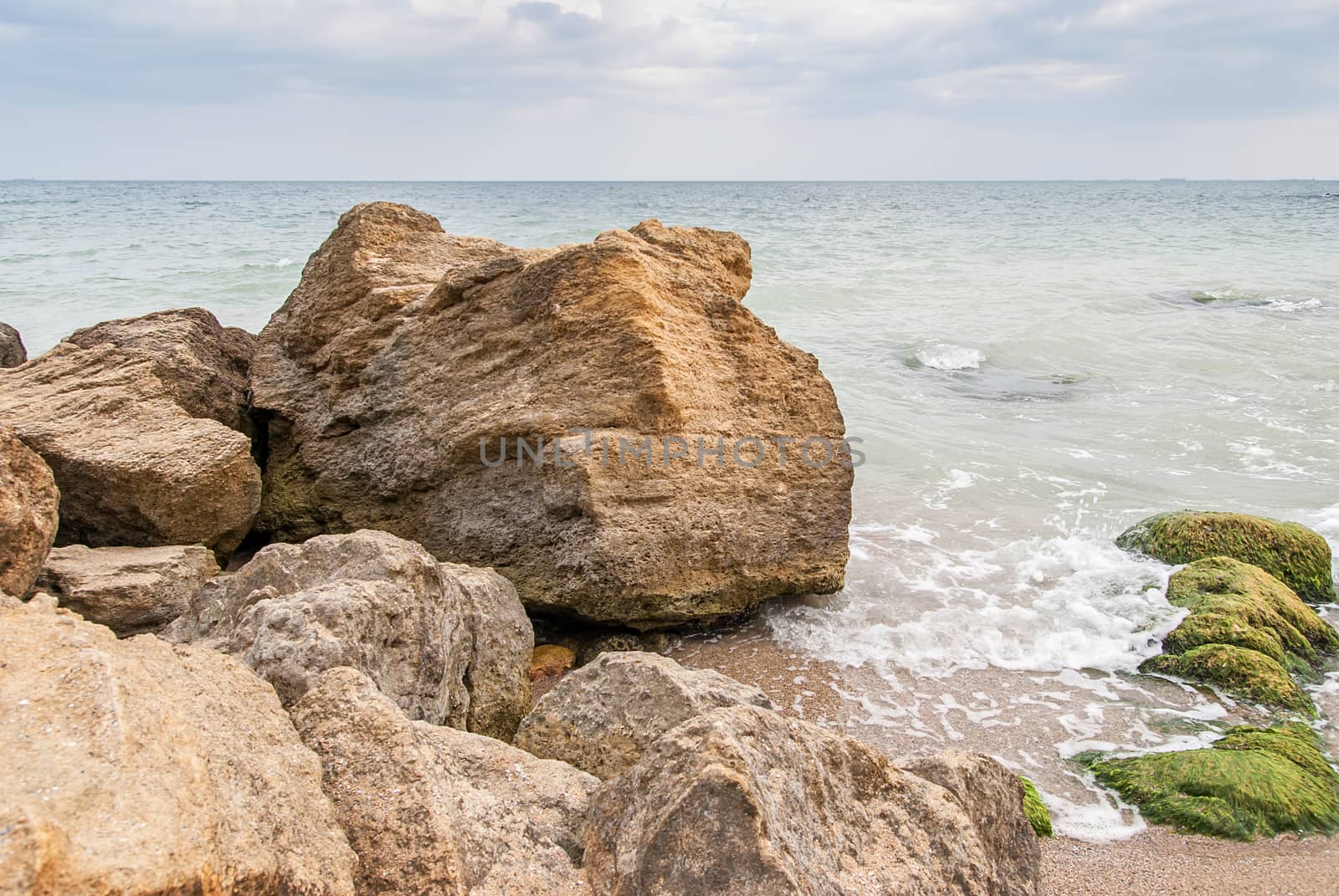 Stones at the seashore in cloudy weather