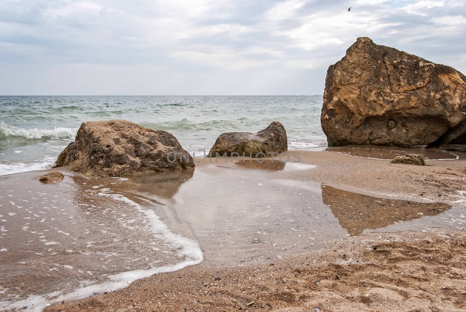 Stones at the seashore in cloudy weather