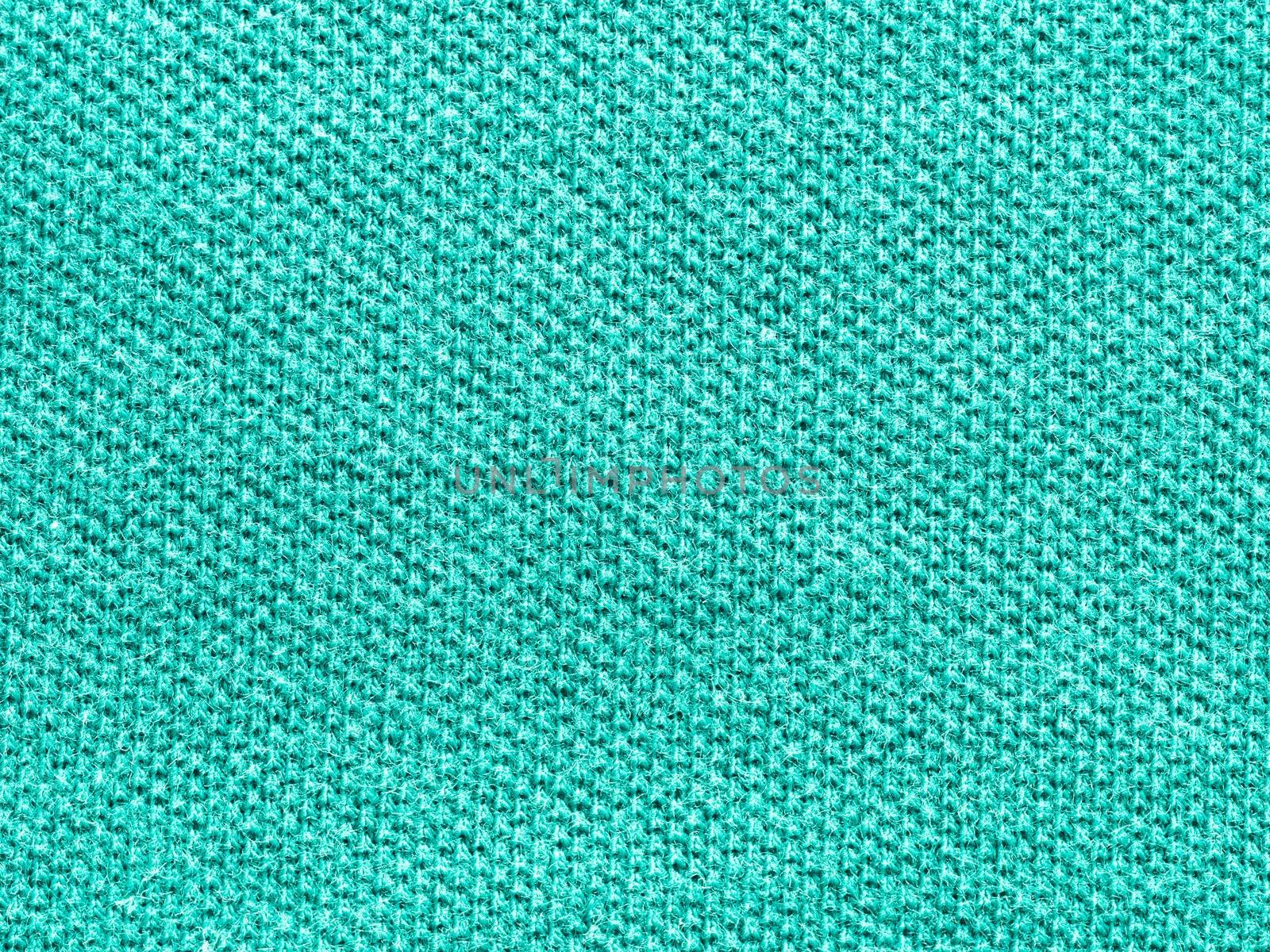 green knitted Jersey polo texture as textile background