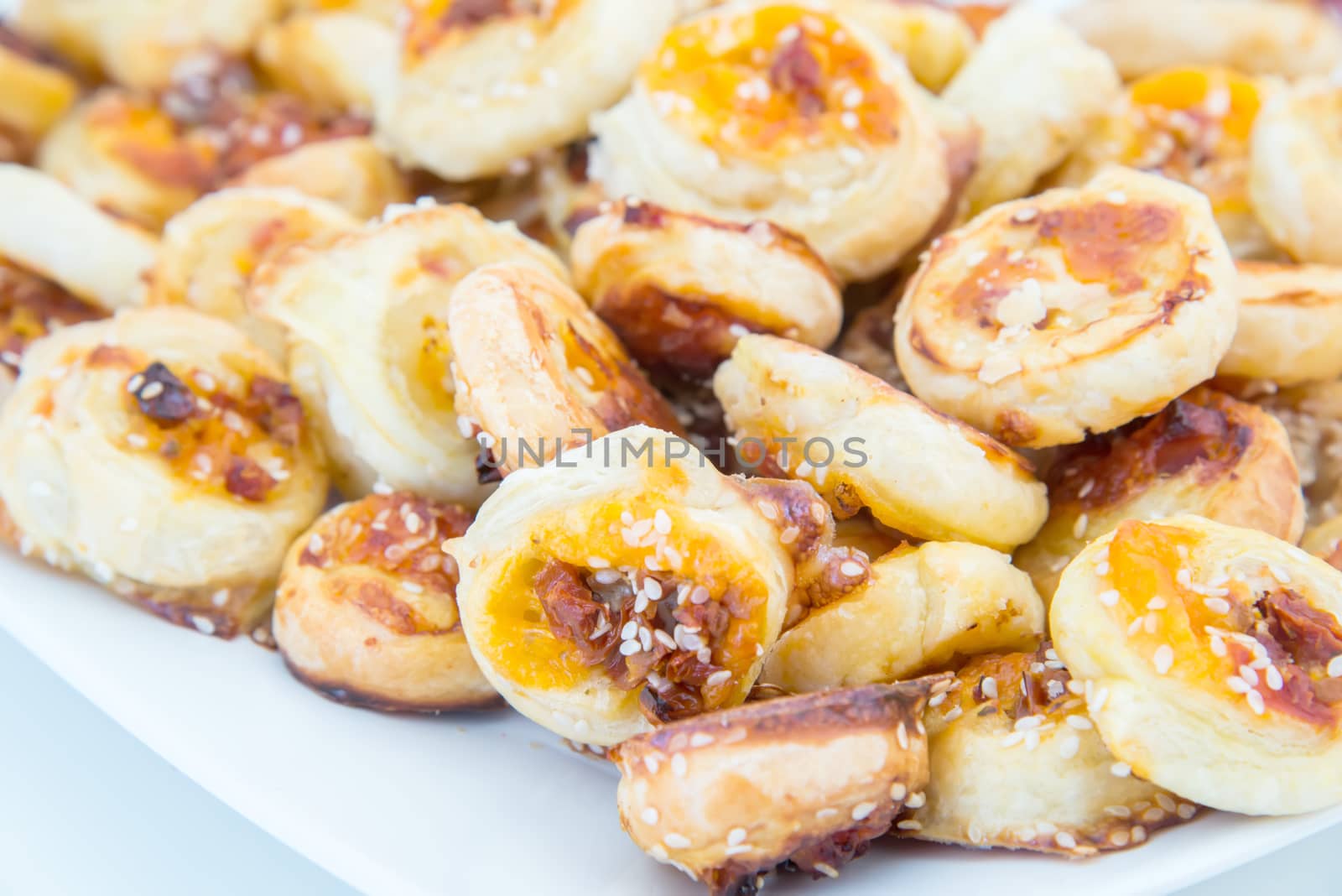 the cookies of puff pastry with sesame seeds