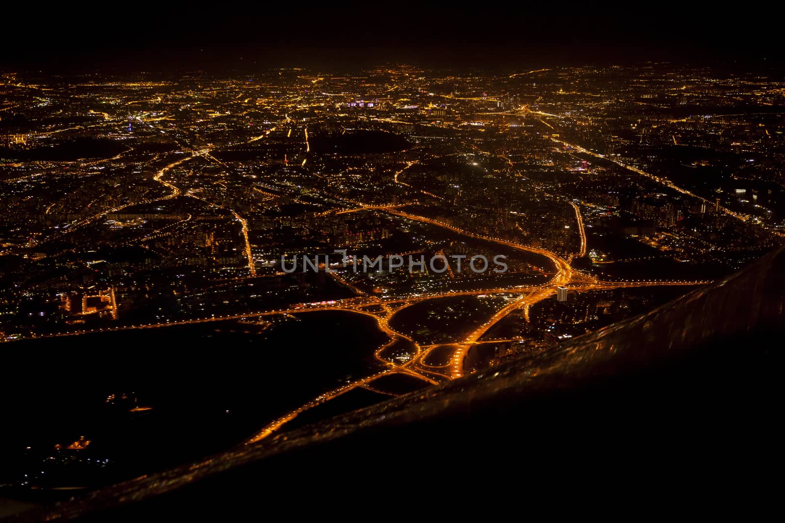 View the city at night from an airplane. by sergey_pankin