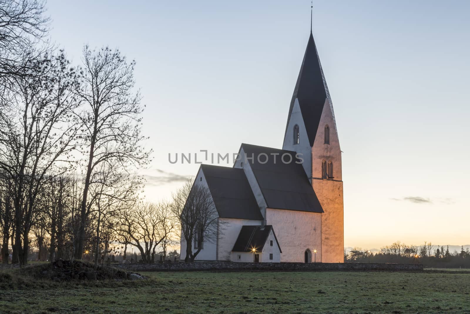 Church in Tofta, Gotland in Sweden with the pathway leading up the the church.
