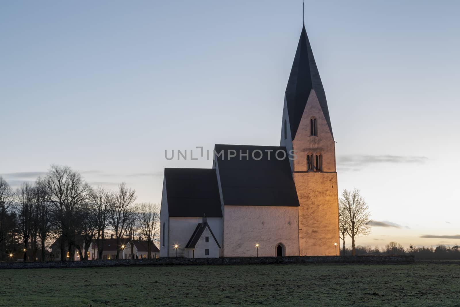 Church in Tofta, Gotland in Sweden with the pathway leading up the the church.