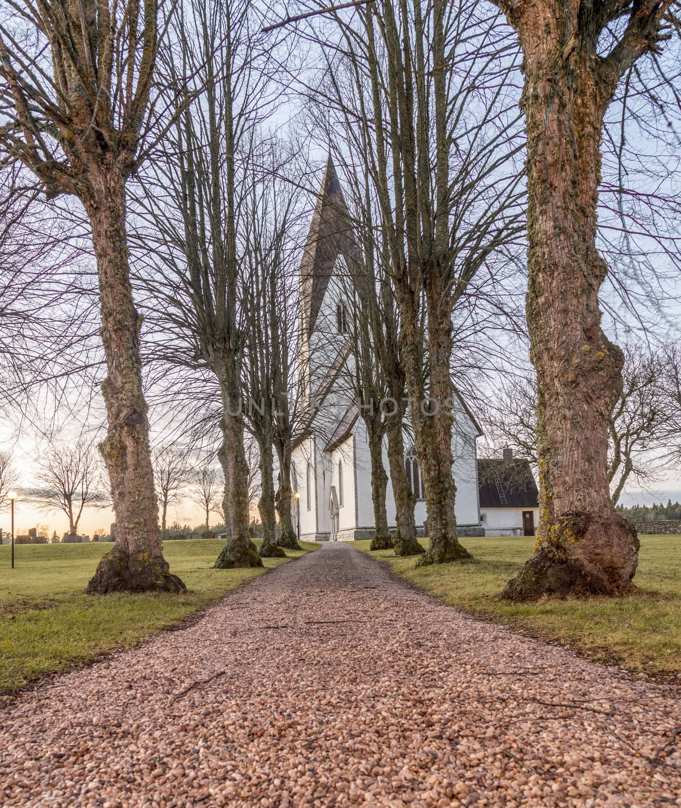 Church in Tofta, Gotland in Sweden with the pathway leading up the the church.