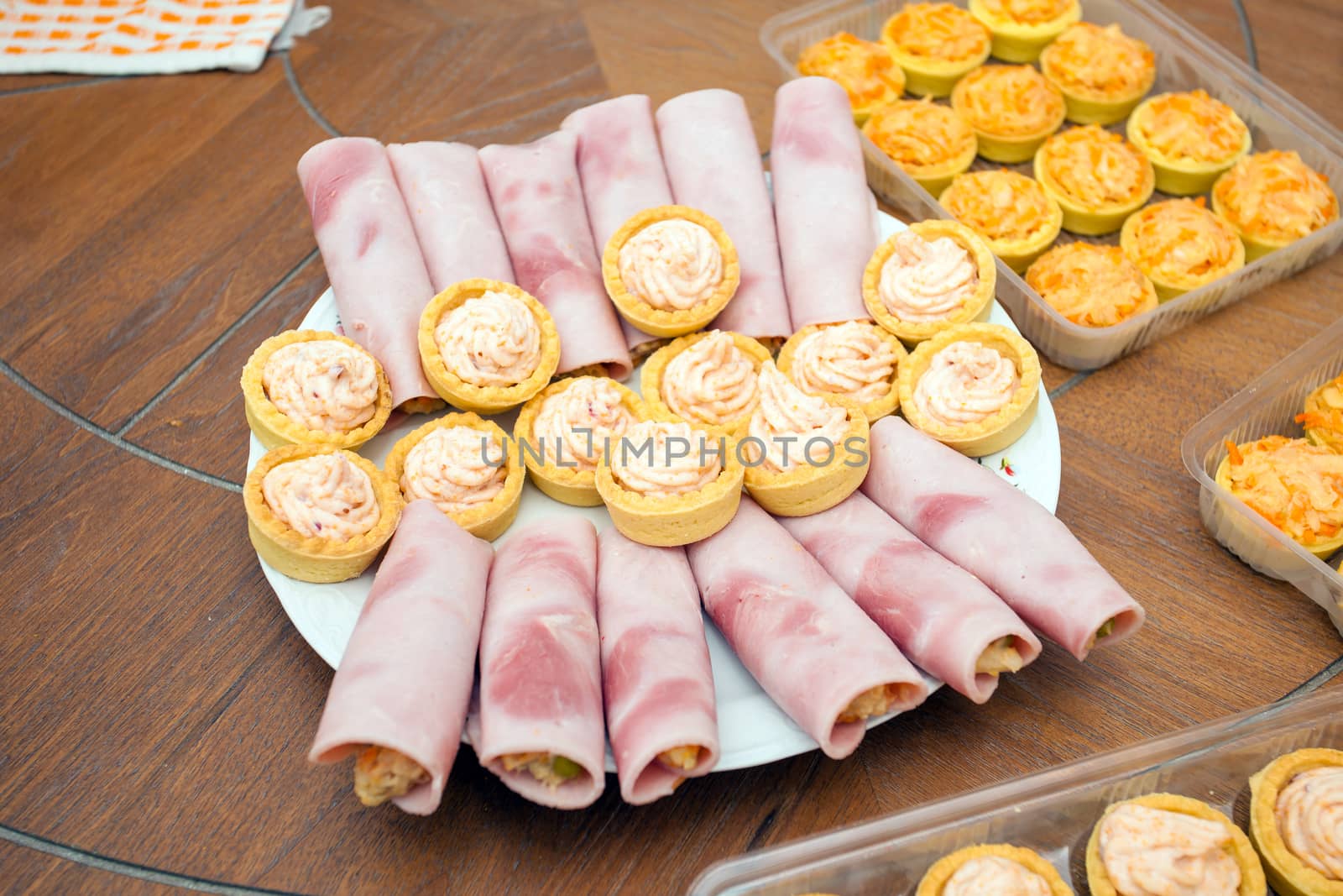 Cocktail food appetizer with ham rolls and and fish roe dip cream pastry