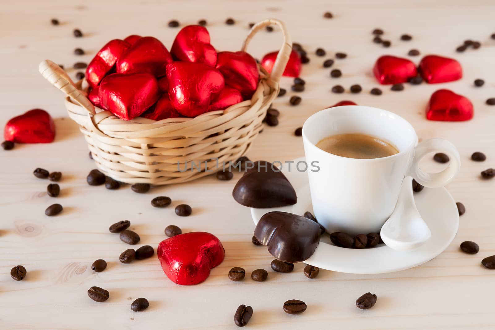 Red chocolate hearts in a small basket and an espresso coffee by LuigiMorbidelli
