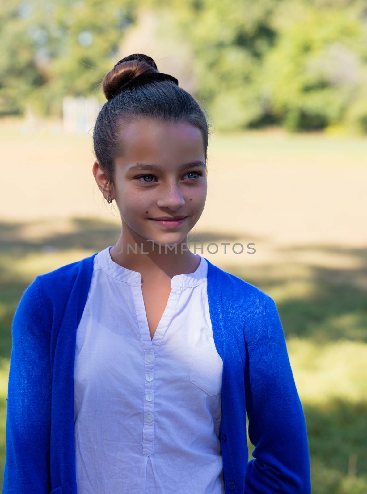 portrait of teen girl outdoors in the park