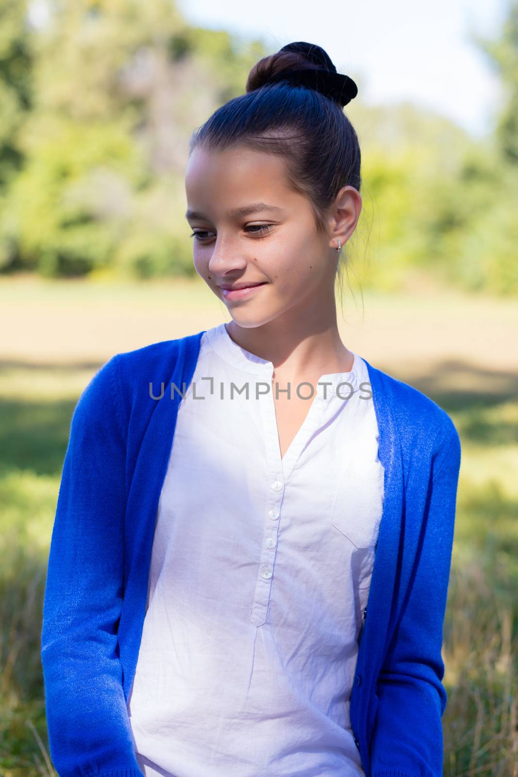 portrait of teen girl outdoors in the park