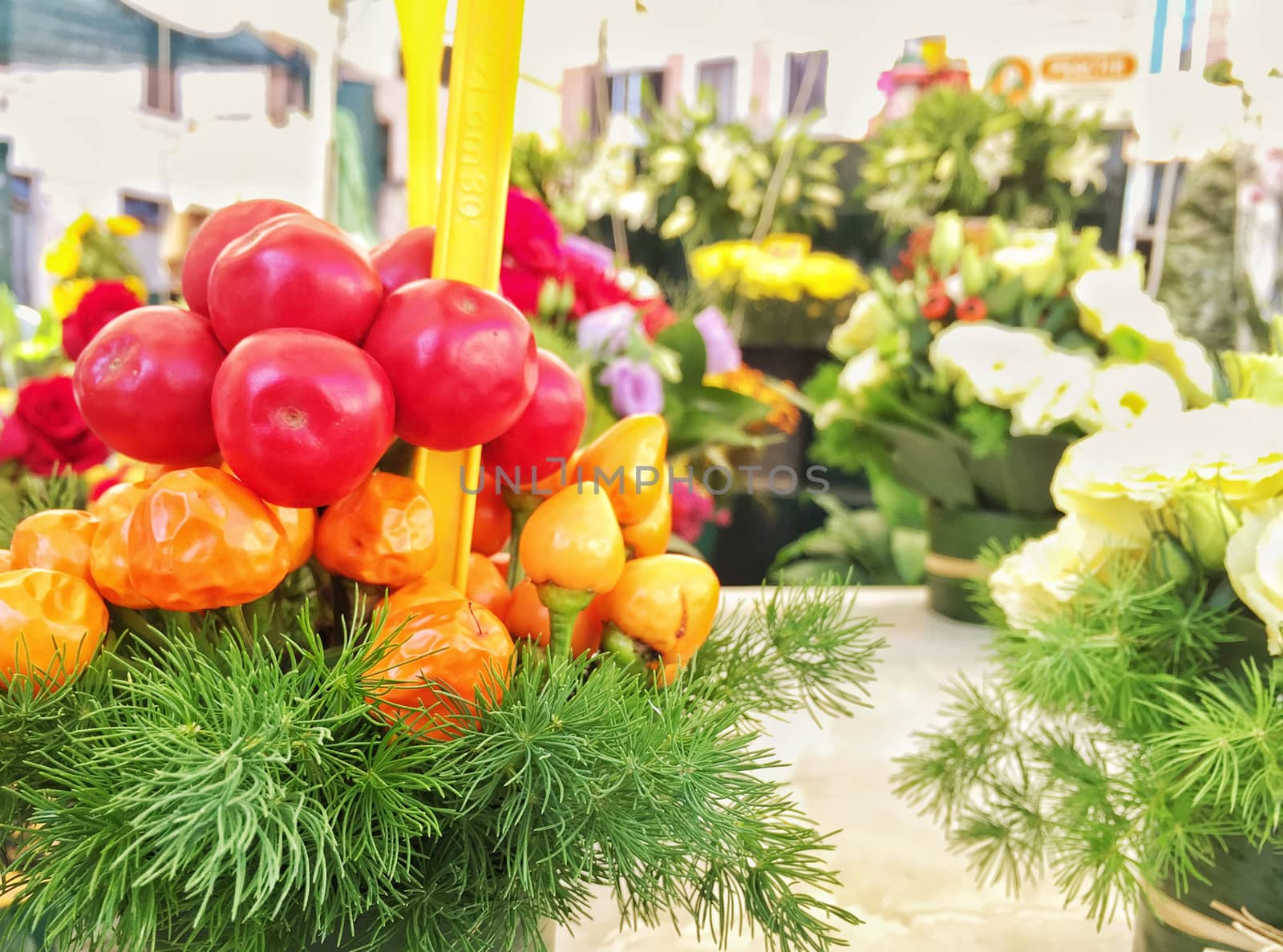 close up of colored vegetables in a vase