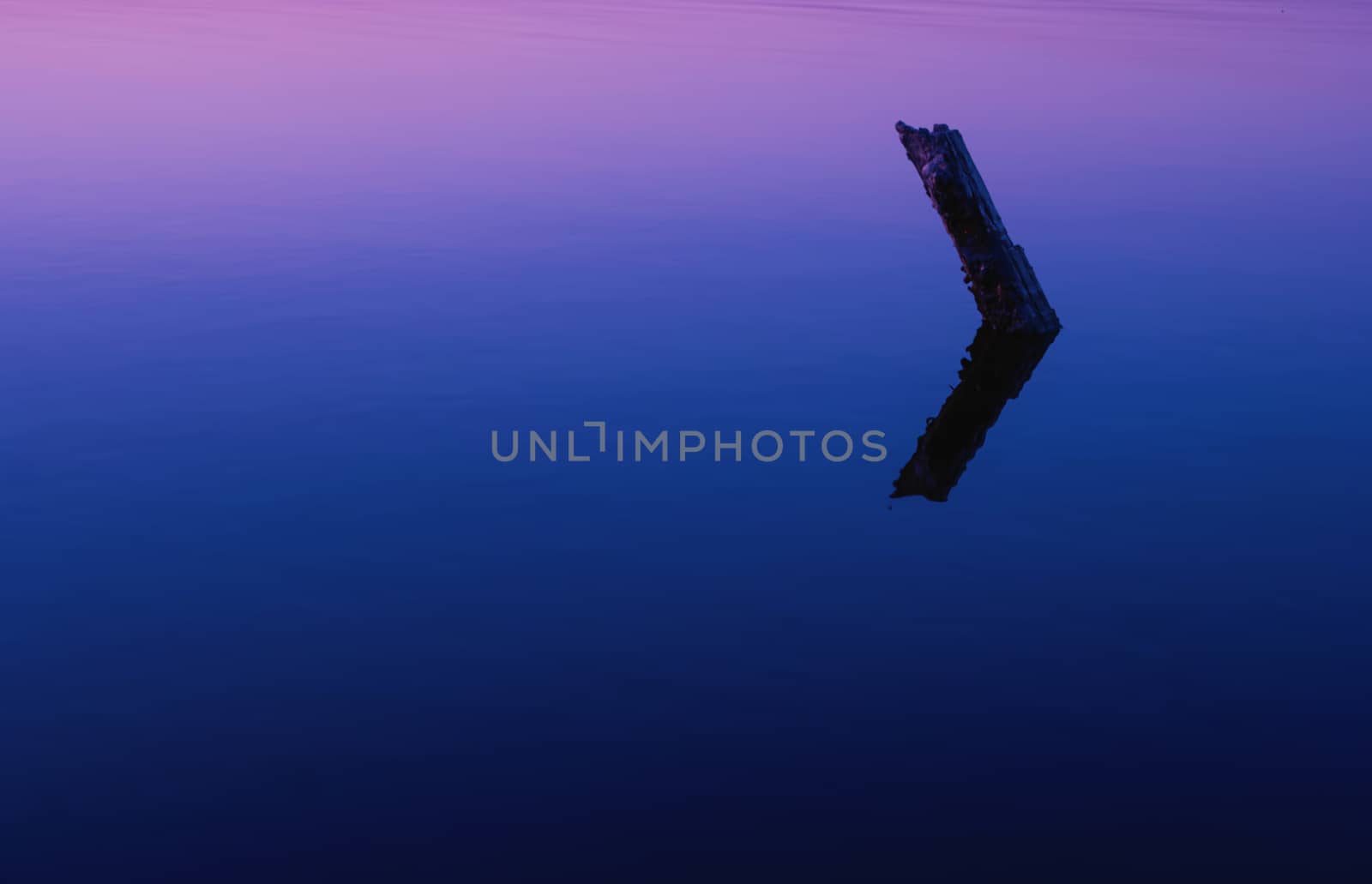 Reflection in the lake colorful bright orange blue sunset