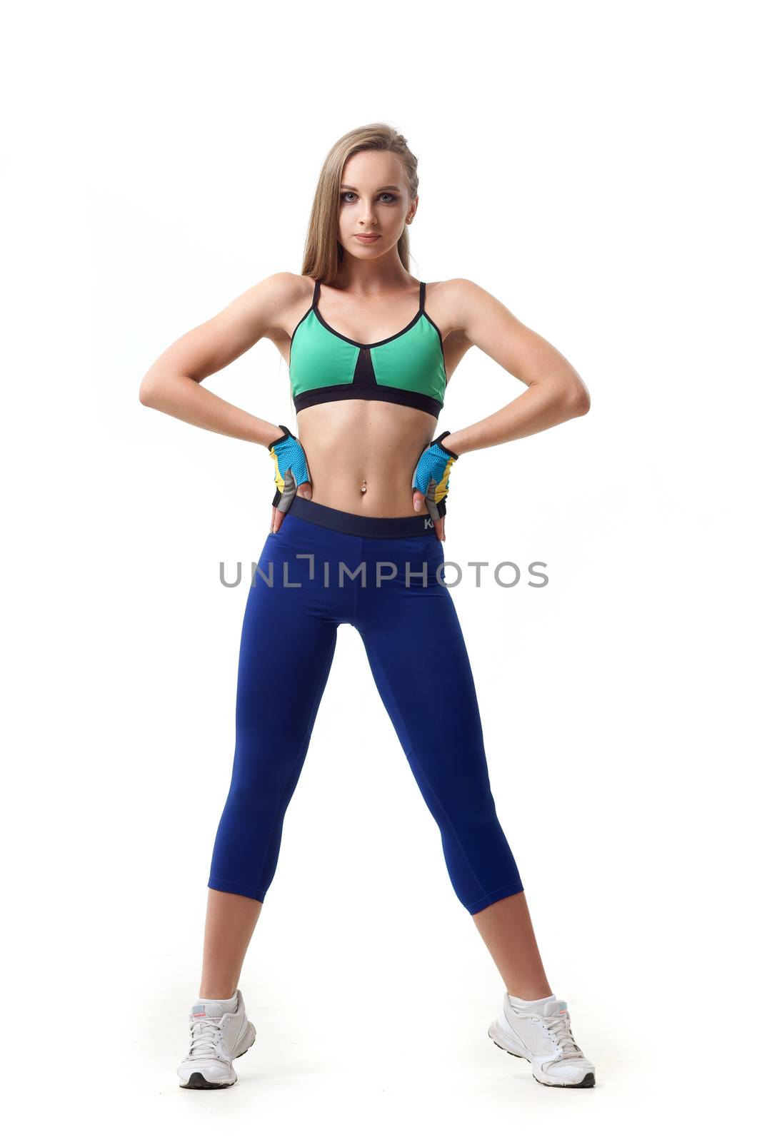 Happy beautiful woman fitness trainer working out isolated on white by mrakor