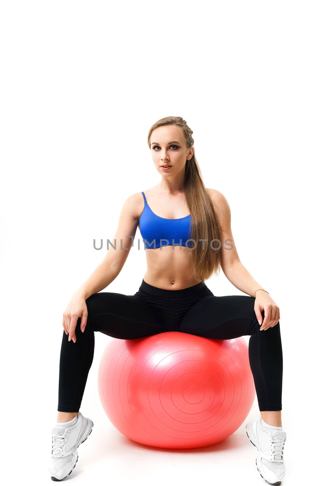 Concepts: healthy lifestyle, sport. Happy beautiful woman fitness trainer working out with fit ball isolated on white background