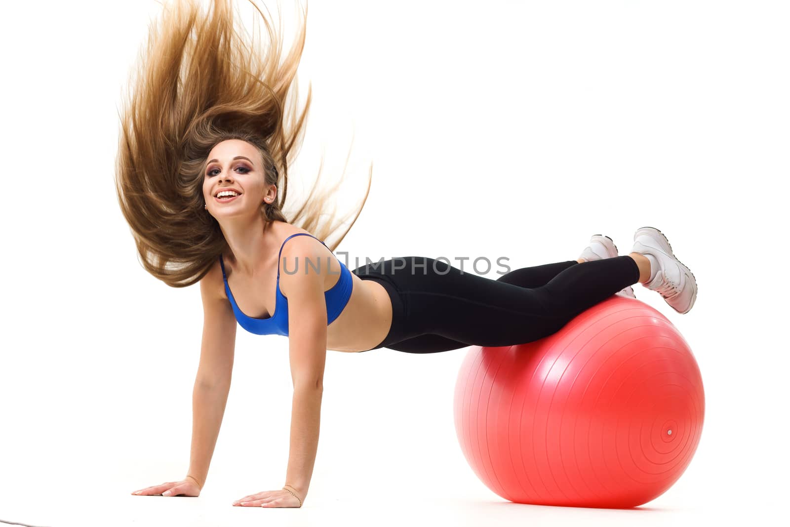 Concepts: healthy lifestyle, sport. Happy beautiful woman fitness trainer working out with fit ball isolated on white background