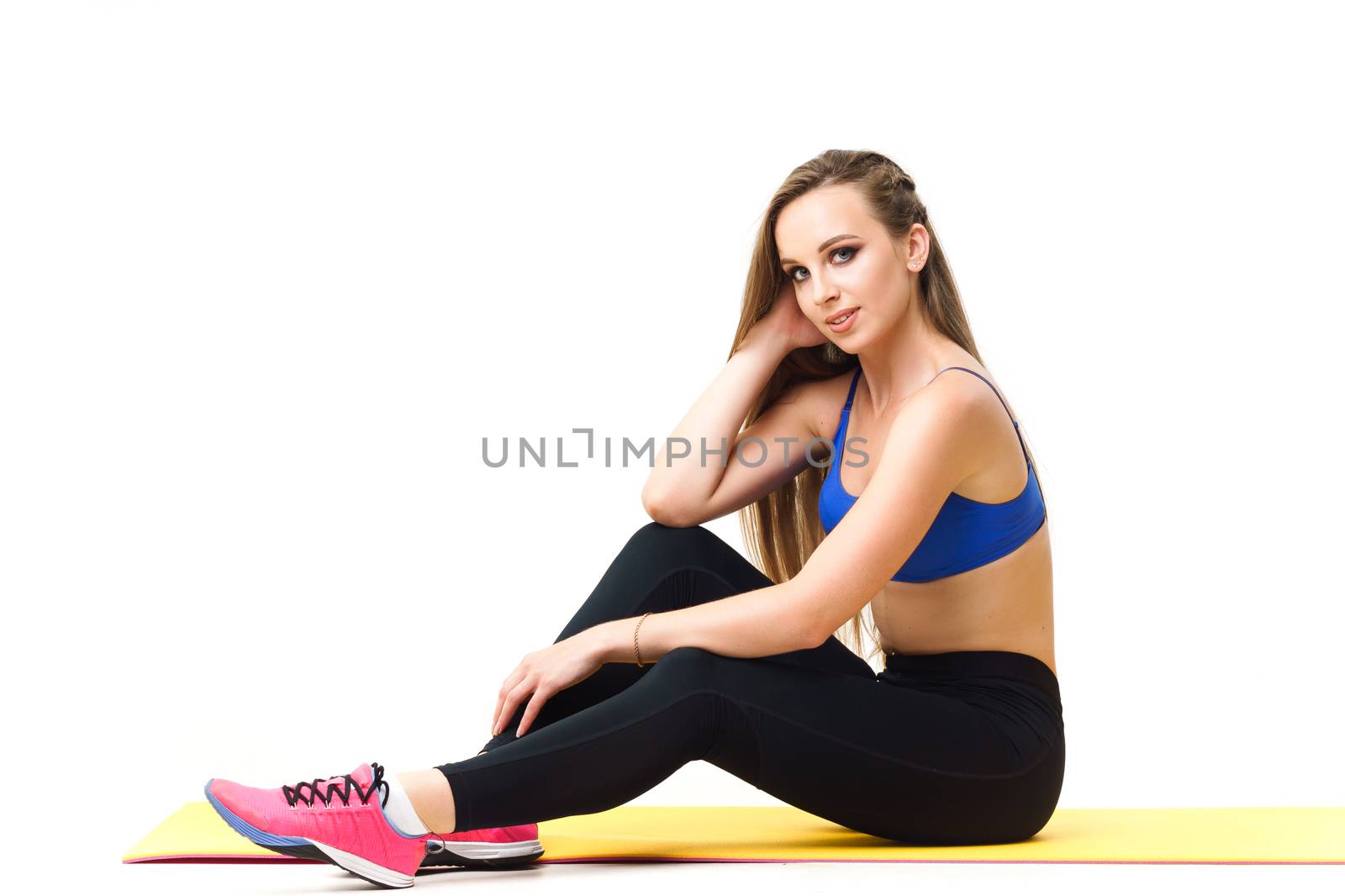 Concepts: healthy lifestyle, sport. Happy beautiful woman fitness trainer working out with yoga mat isolated on white background