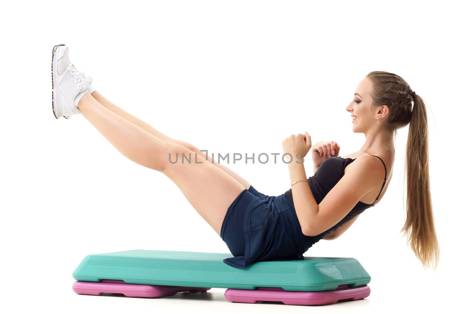 Concepts: healthy lifestyle, sport. Happy beautiful woman fitness trainer working out step aerobics isolated on white background