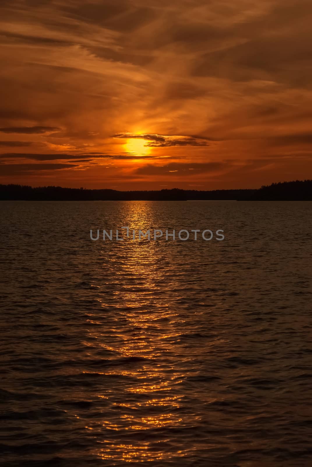 Red sunset at lake Saimaa in Finland.