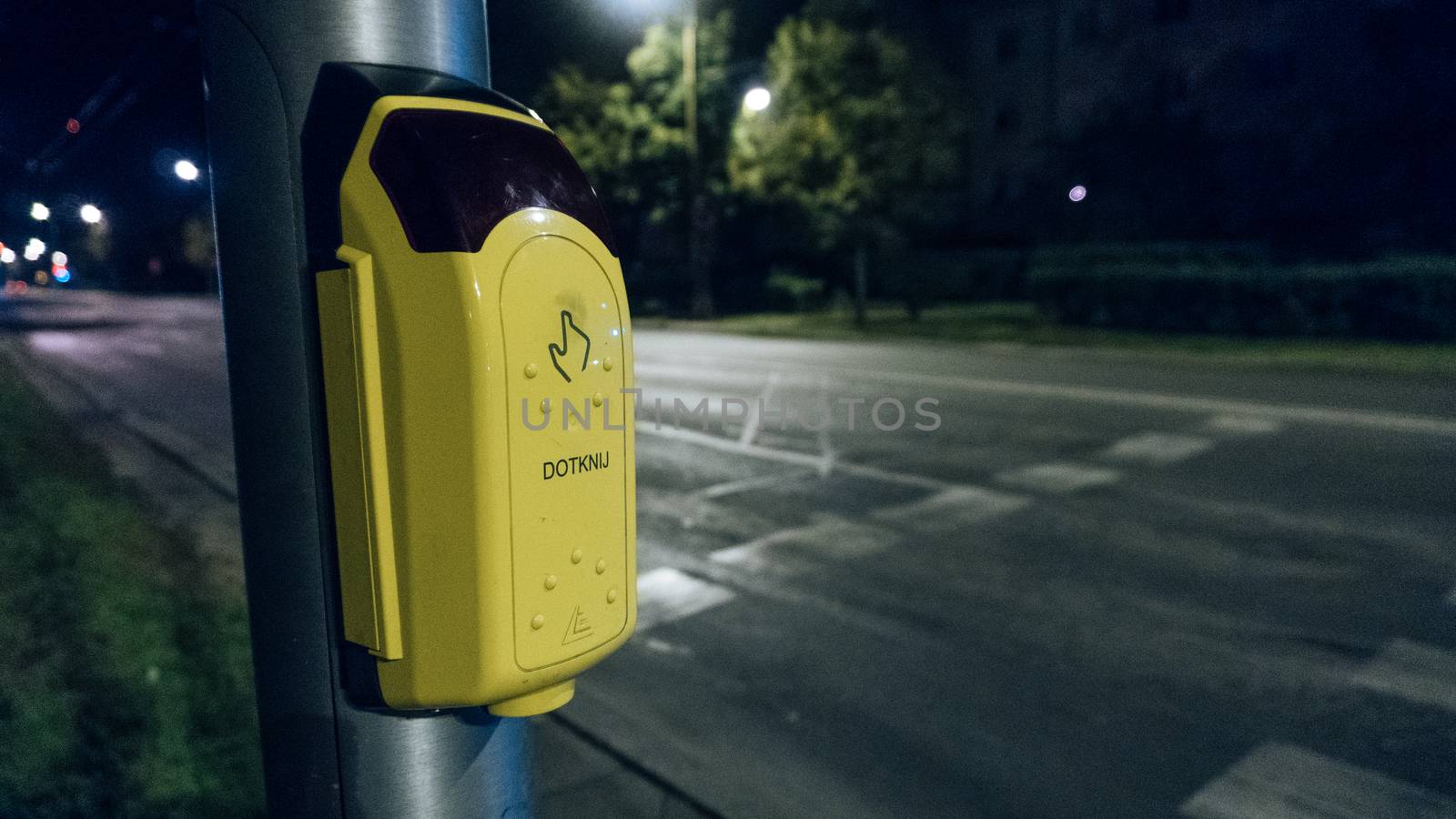 Button to Cross the Street in Crowded Area in the City
