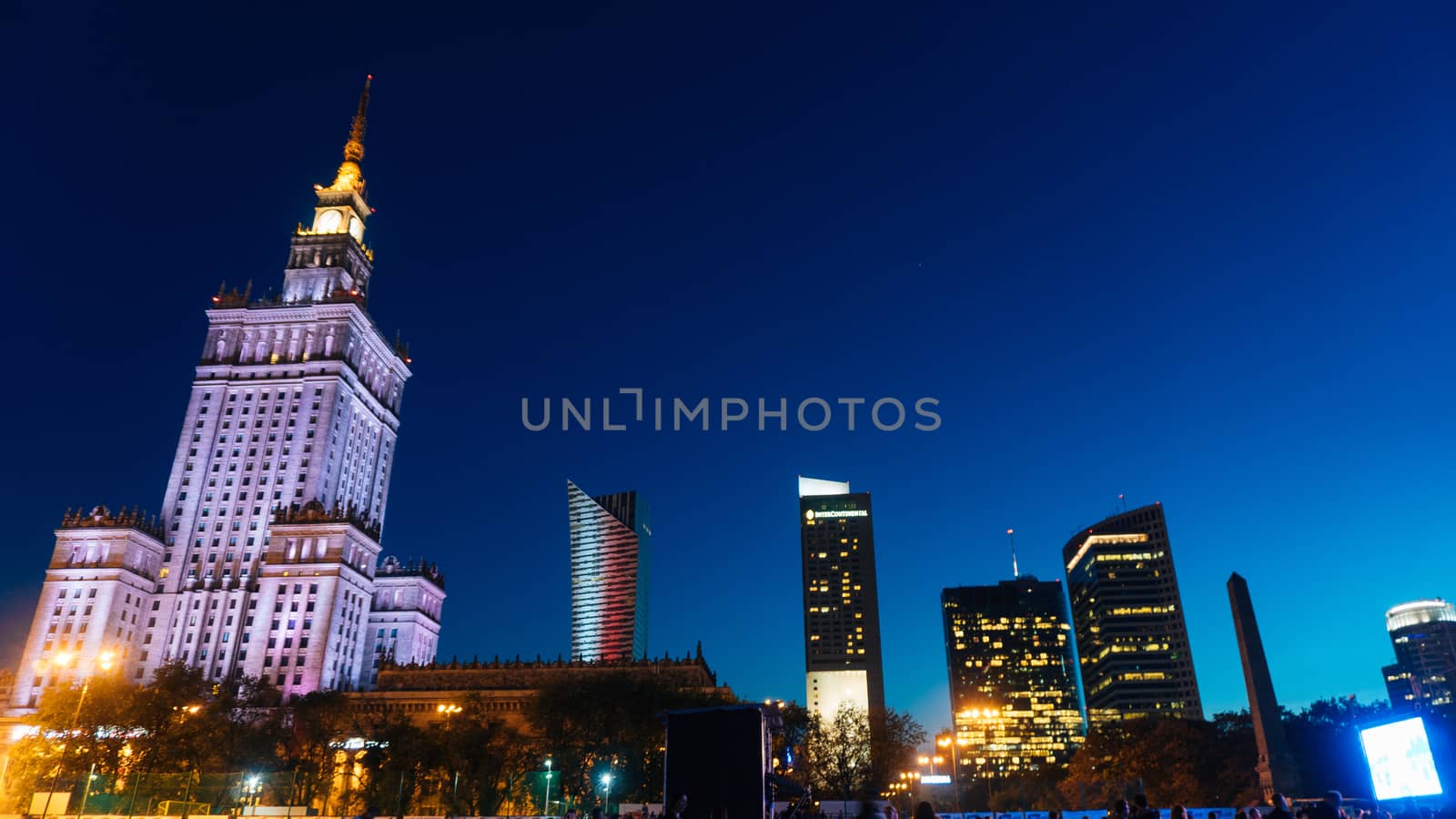 Warsaw, Poland. City center with Palace of Culture and Science, a landmark and symbol of Stalinism and communism, and modern sky scrapers.