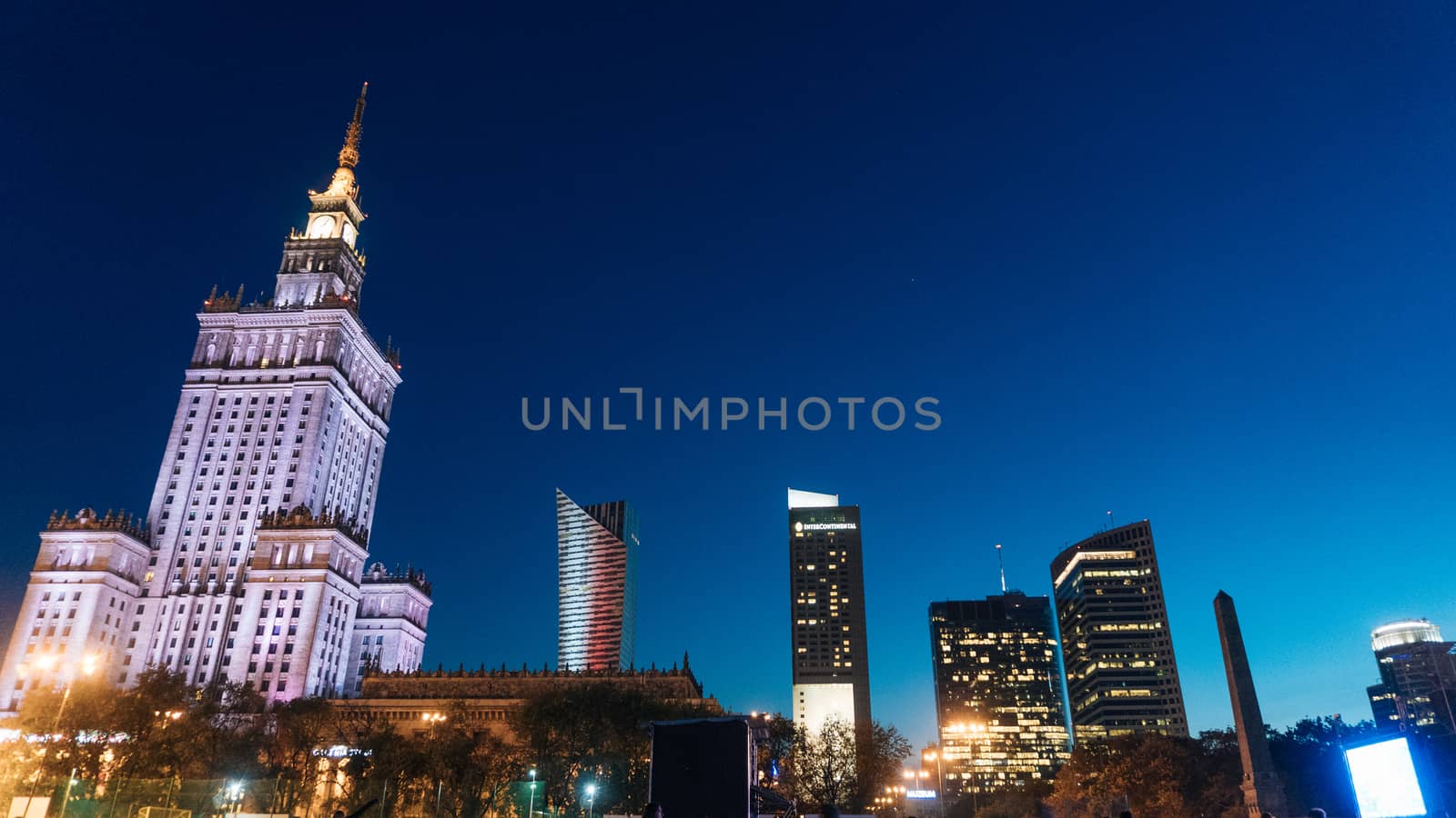 Warsaw, Poland. City center with Palace of Culture and Science, a landmark and symbol of Stalinism and communism, and modern sky scrapers.