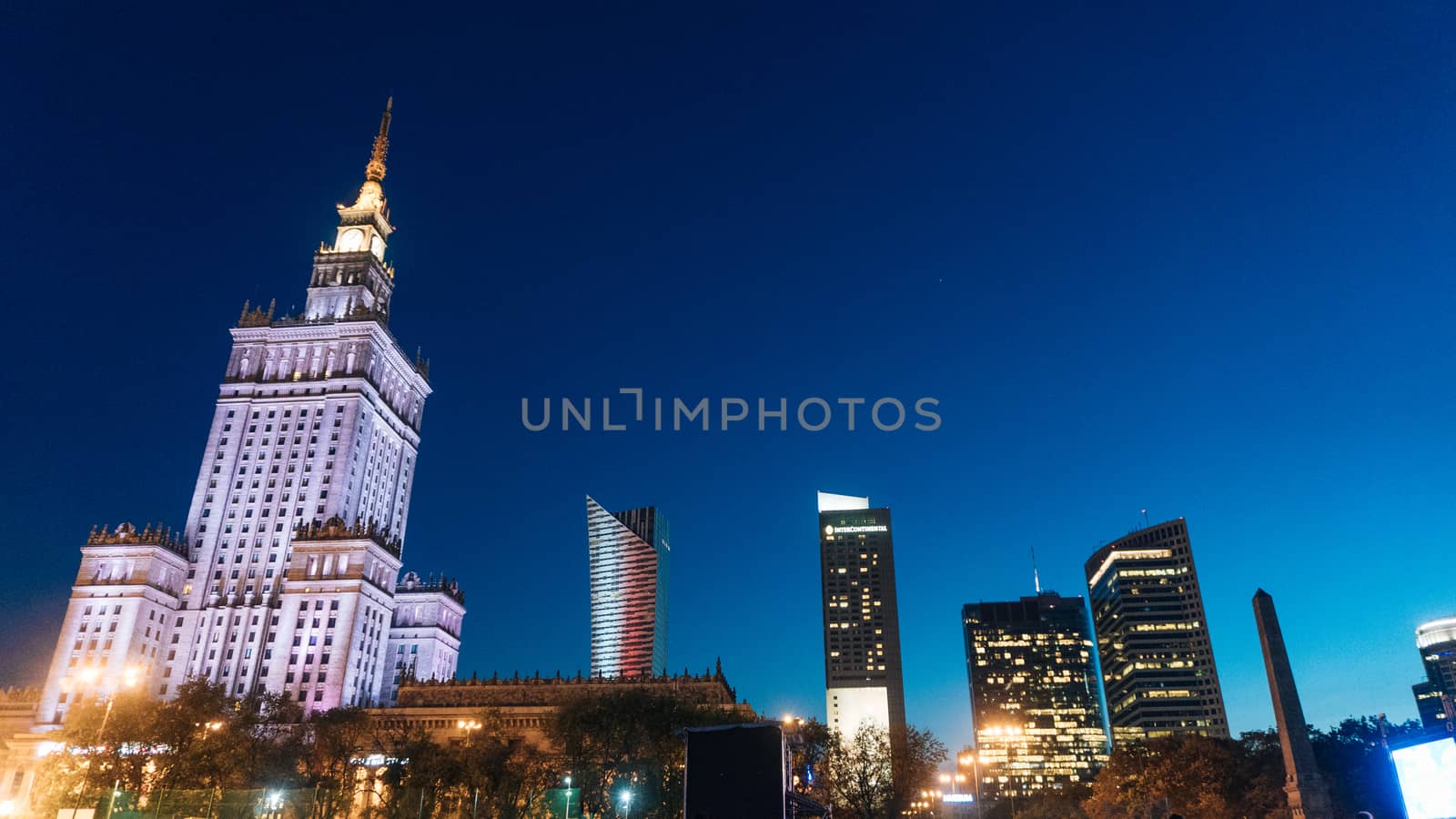 Warsaw, Poland. City center with Palace of Culture and Science, a landmark and symbol of Stalinism and communism, and modern sky scrapers.