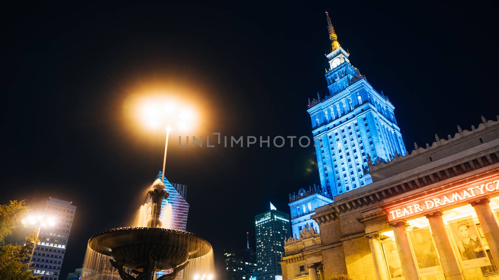 Warsaw, Poland. City center with Palace of Culture and Science, a landmark and symbol of Stalinism and communism, and modern sky scrapers.