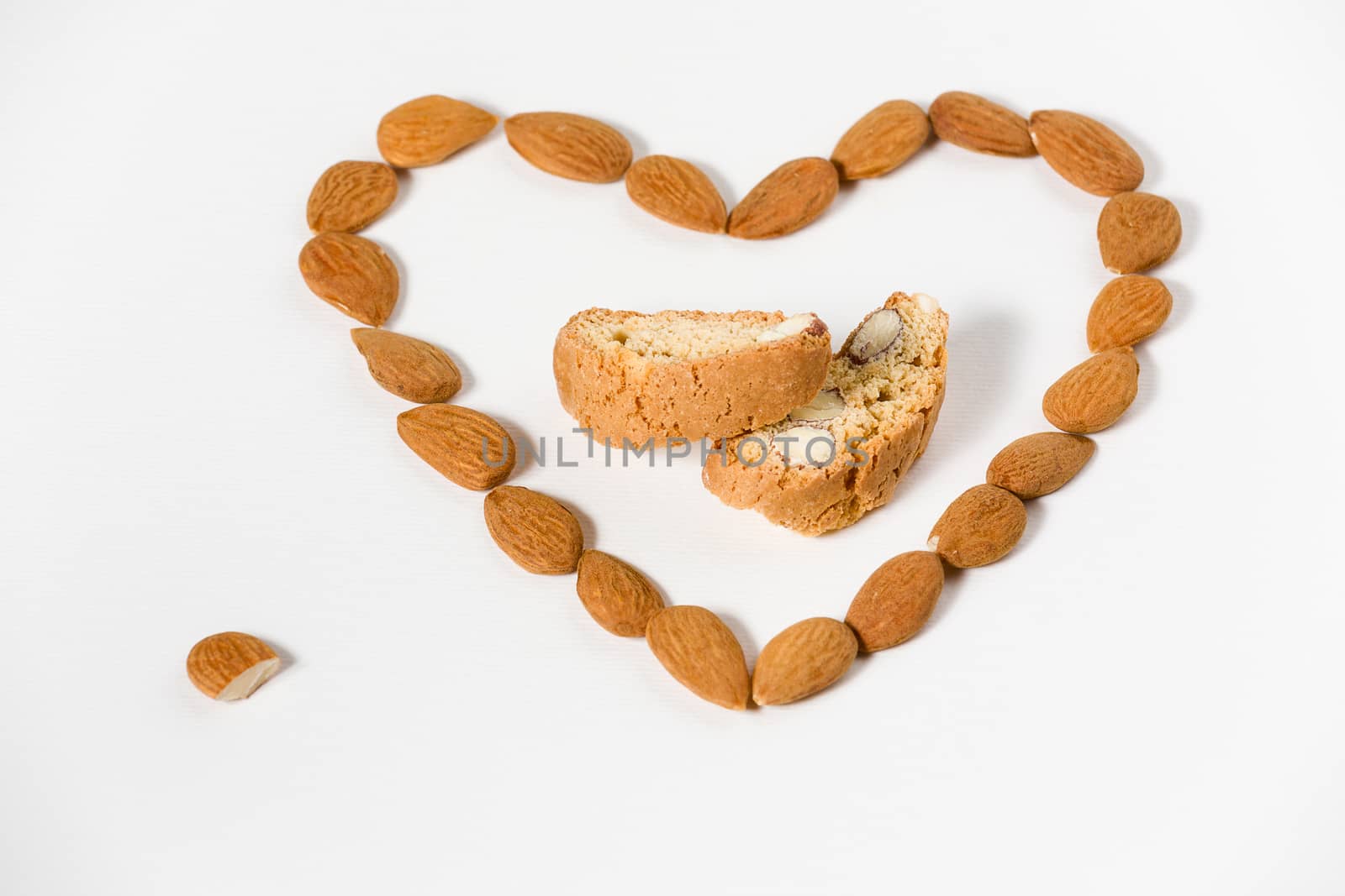 Cantuccini with almonds heart shape on white background