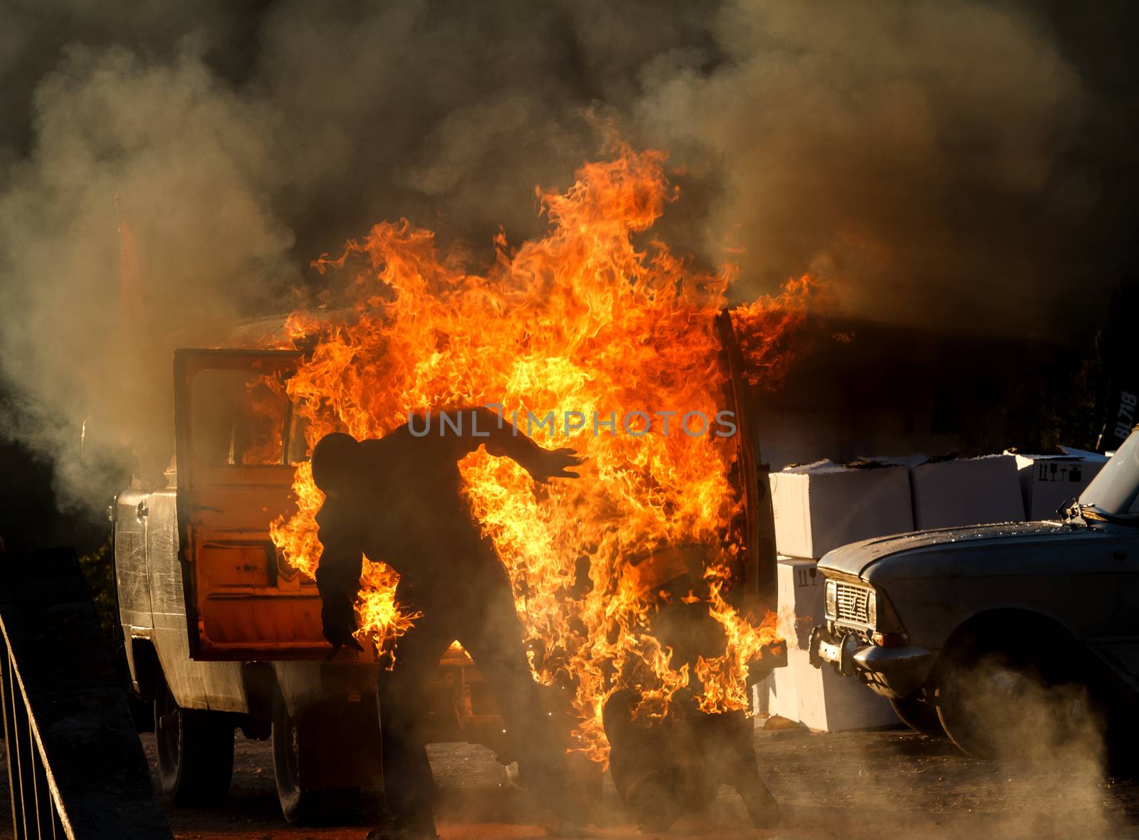 people jumping out of burning car on the move