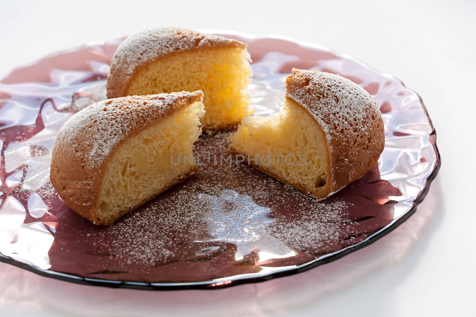 Slices of cake over a plate on a white background