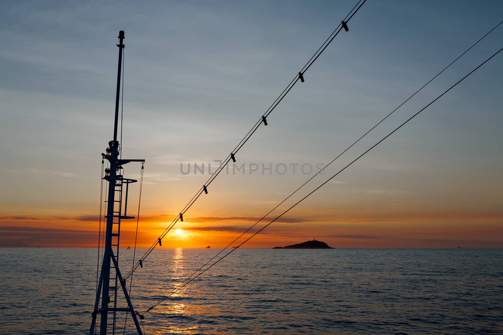 Beautiful sunset viewed by a ship